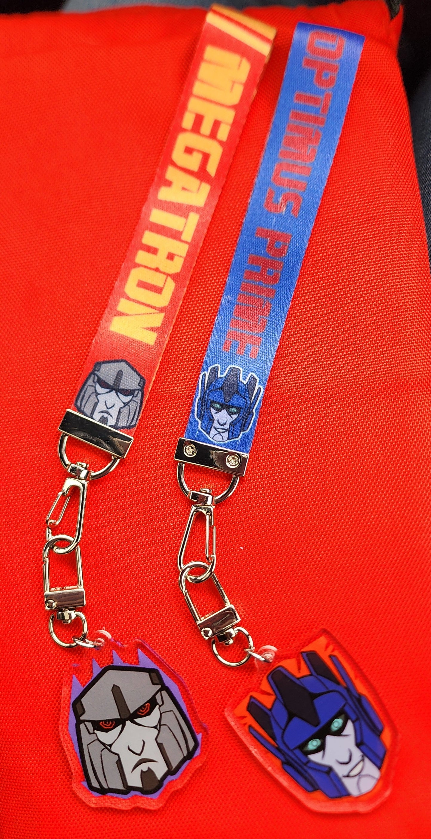 TF:O Optimus and Megatron lanyards
